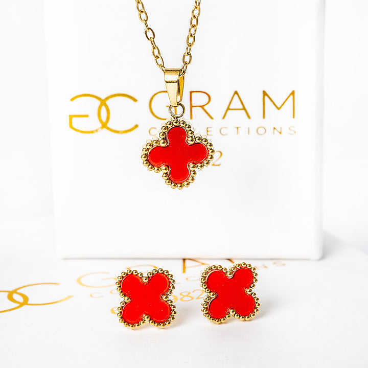 An Fiore Set in red colour pendant standing in the center of the image against its uniquely designed box. 