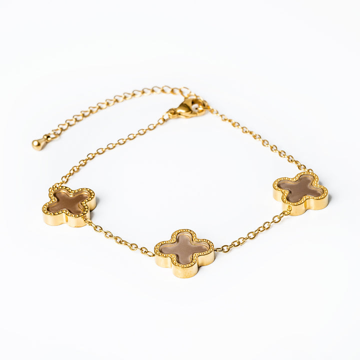 A close up view of Fiorella Bracelet in brown colour standing in the center of the image against a white background. 