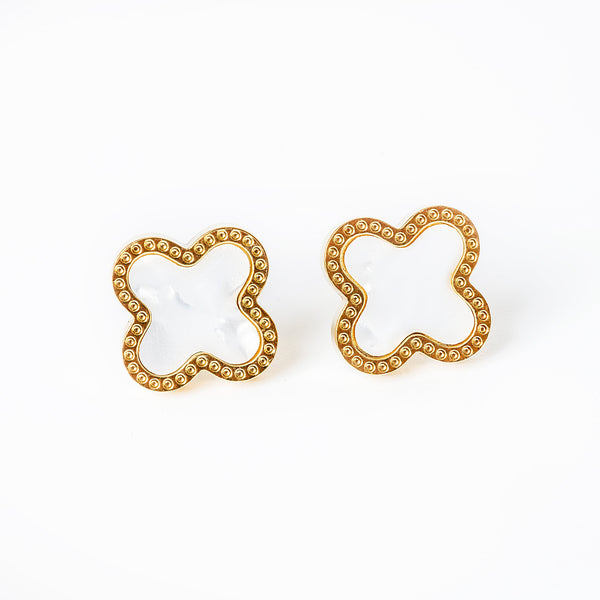 a close up view of Fiorella Earrings standing in the center of the image 