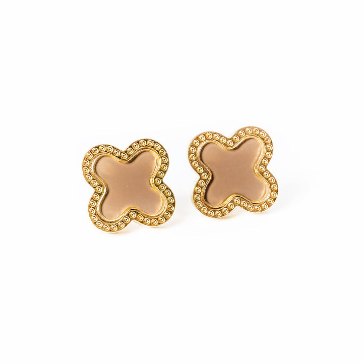 A close up view of Fiorella Earrings standing in the center of the image against a white background. 