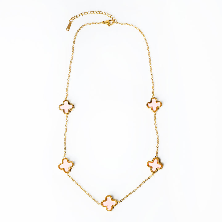 Fiorella Necklace in pink colour standing in the center of the image against a white background. 