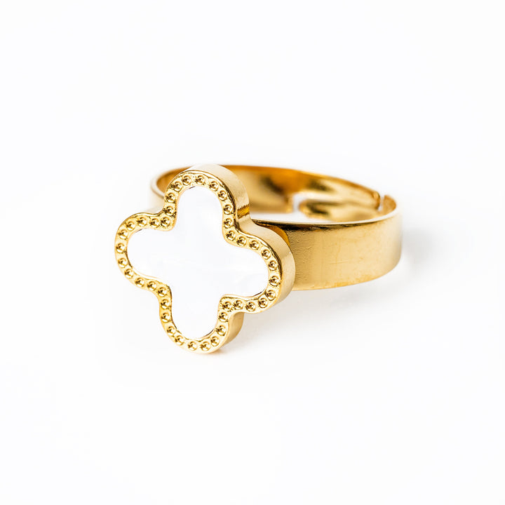 A close up view of Fiorella Ring standing in the center of the image against a white background. 