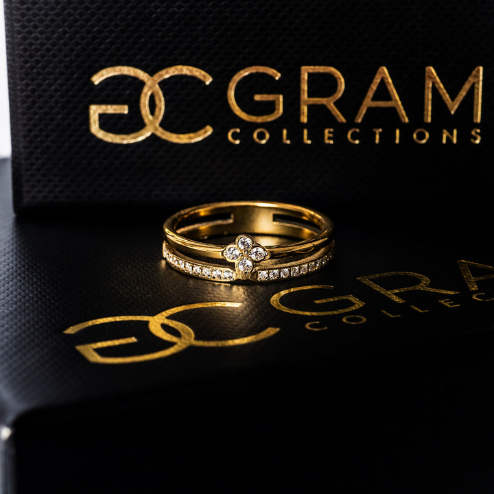 Fleur Gold Ring placed on its uniquely designed black box. 