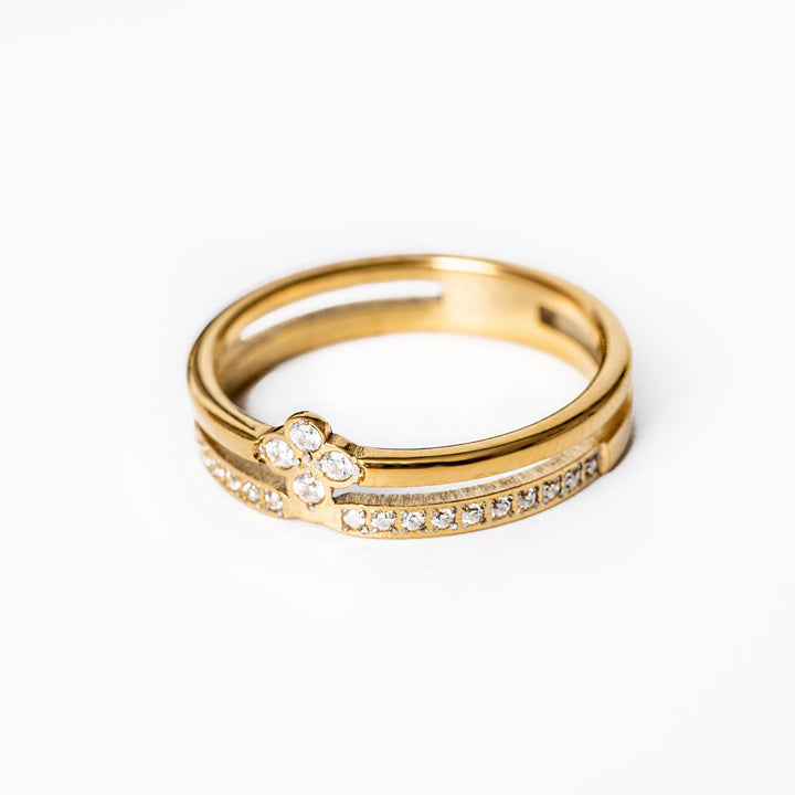 Fleur Gold Ring standing in the center of the image against a white background. 
