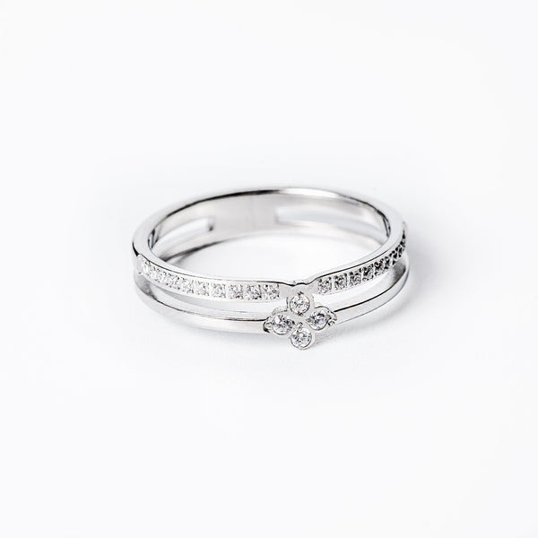 A close up view of Fleur Silver Ring standing in the center of the image. 