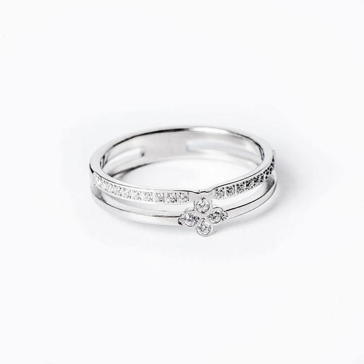 A close up view of Fleur Silver Ring standing in the center of the image. 