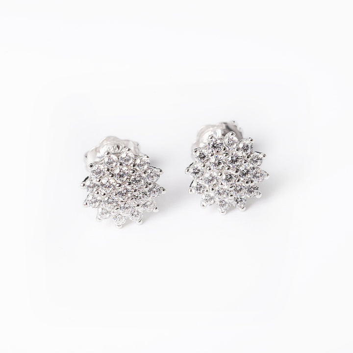 A pair of sterling silver Flora earrings with a geometric pattern of cubic zirconia gems.