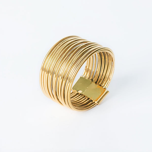 Francis gold ring with multiple thin curved bands