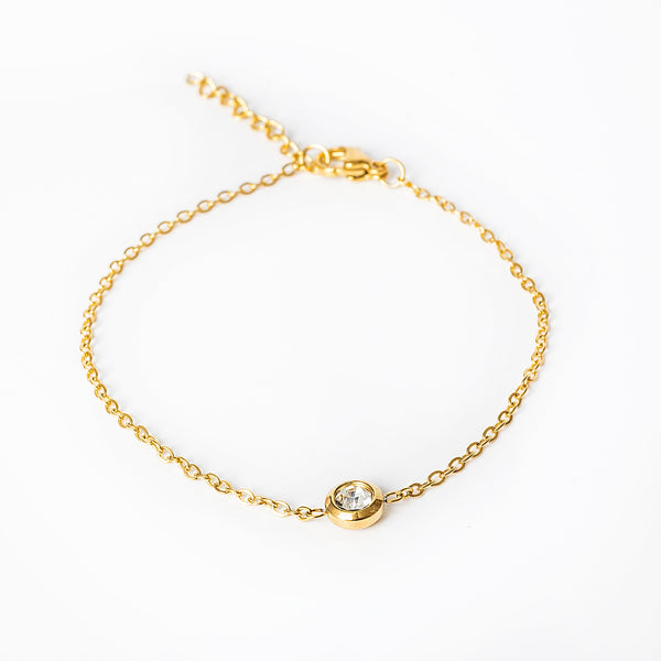 A close up view of Gabriella Gold bracelet, standing in the center of the image against a white background. 