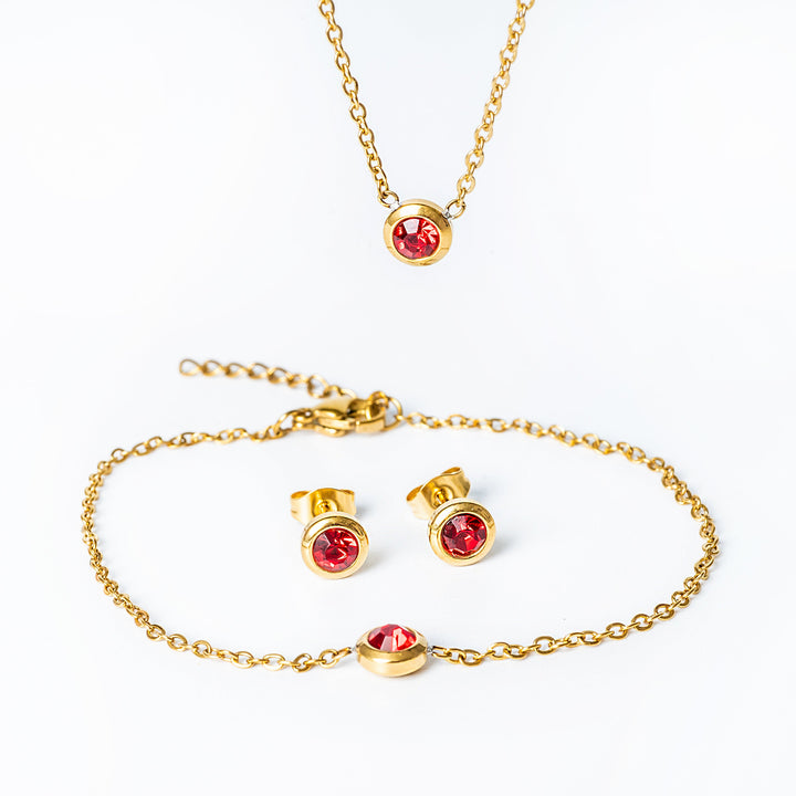 A close up view of Gabriella Gold Necklace standing in the center of the image against a white background. 