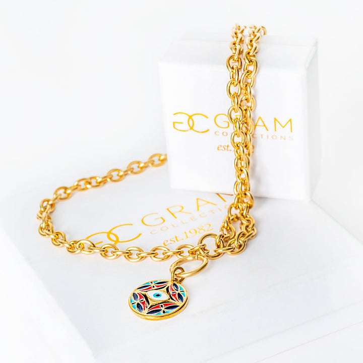 Gold chain Ghajn bracelet with a colorful pendant on a white background with 'Glam Collection' branding.