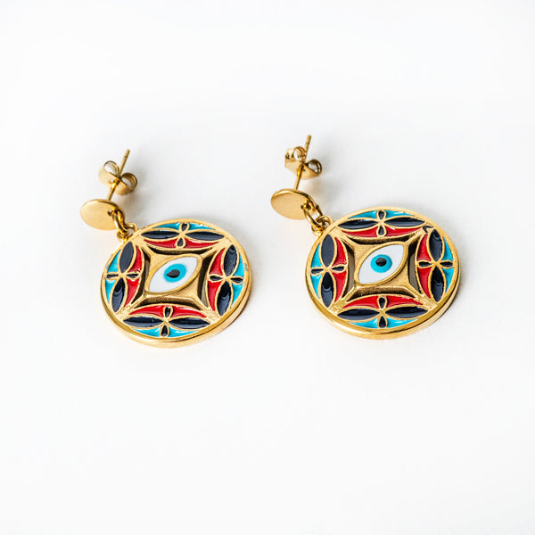 Pair of gold Ghajn earrings with colorful circular designs on a white background