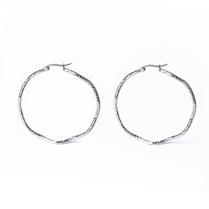 A close up view of Grace Earrings standing in side by side formation surrounded by a white background. 