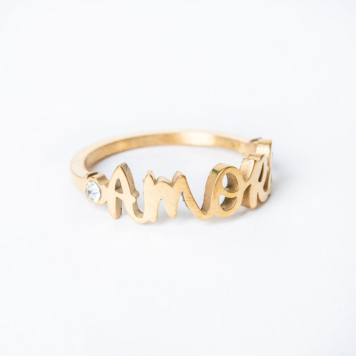 A close up of the amore ring, positioned in the center of the image against a white background. 