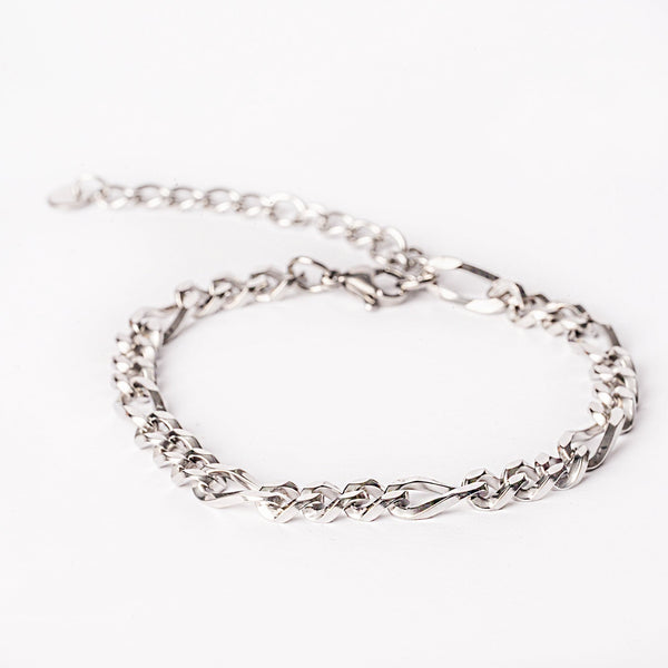 A silver stainless steel bracelet with a solid pattern and a clasp closure on a white background.