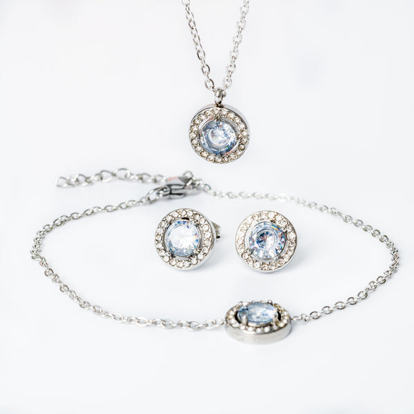 A silver necklace with two round cubic zirconia charms and a chain-link design.