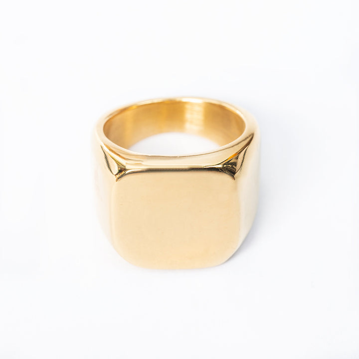 Gold plated Adrian ring on a light background