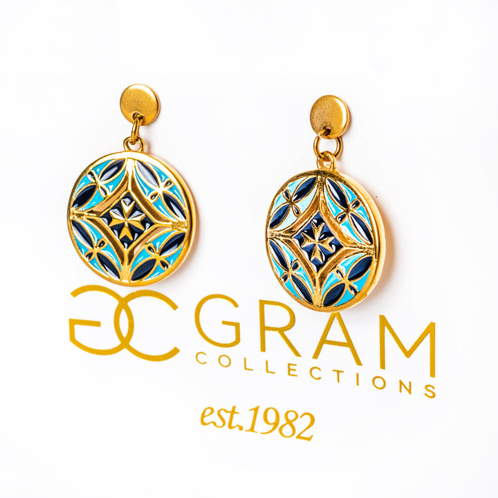 Gold and blue Malta earrings with 'GRAM Collections' logo on a white background