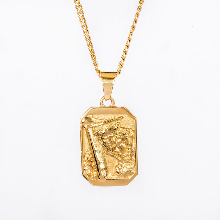 Gold plated pendant necklace on a white background