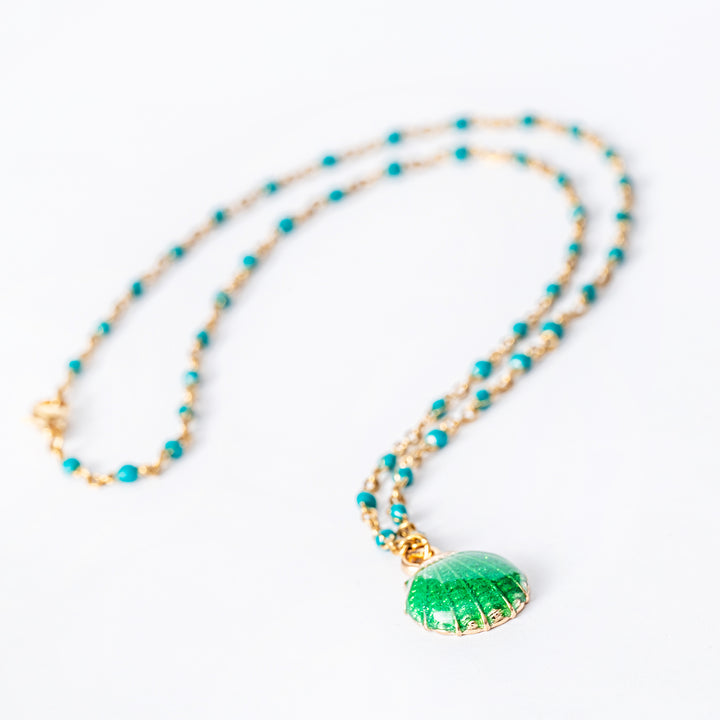 Seashell Necklace standing in the center of the image against a white background. 