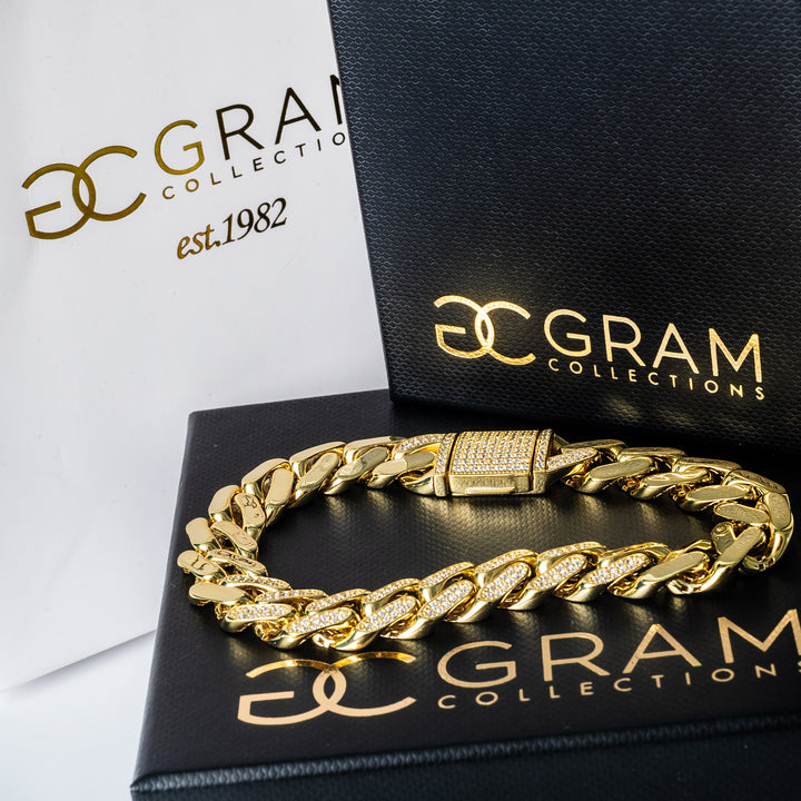 Vienna bracelet placed on its box, with two more box standing in the background, one white, another black as well. 