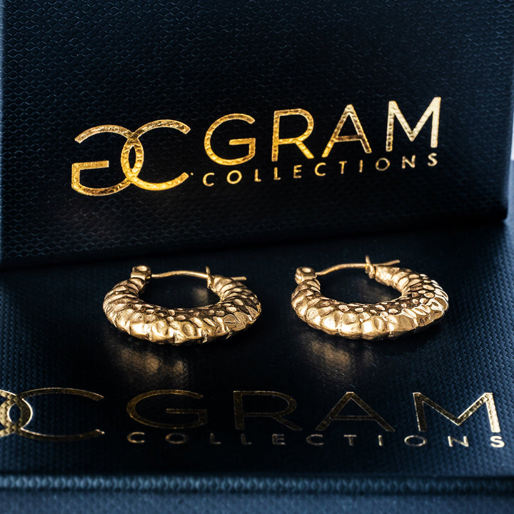 A gram collections Graziella Gold Earrings placed on its box. 