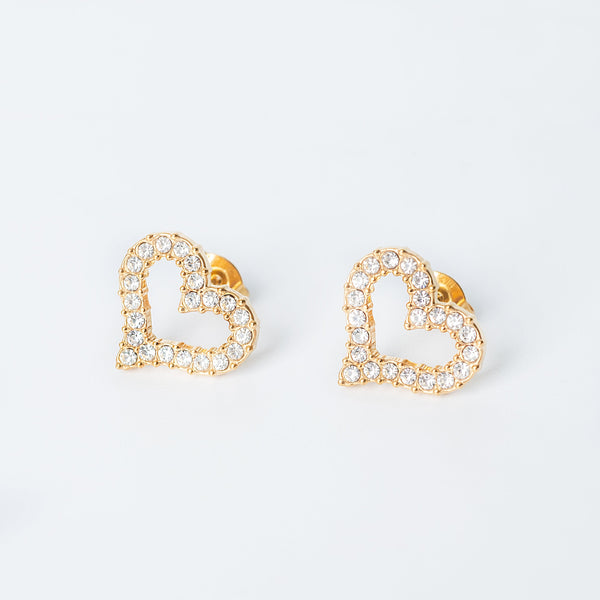 Gold Gwenith heart earrings lined with clear crystals displayed on a white background
