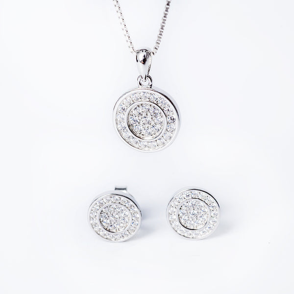 A sterling silver jewelry Hannah set including a pendant, chain, and earrings, adorned with cubic zirconia.