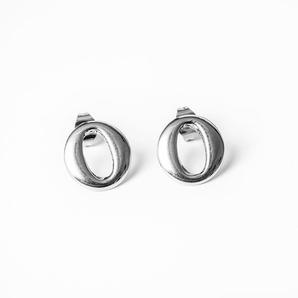 A pair of silver earrings with a simple hoop design, placed against a white background.