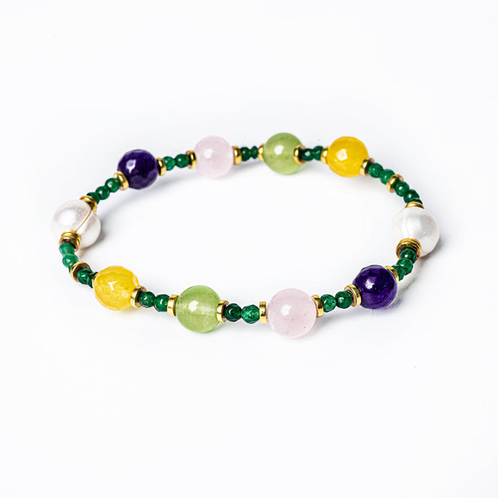 A multicolored beaded bracelet with gold plating and natural stones.