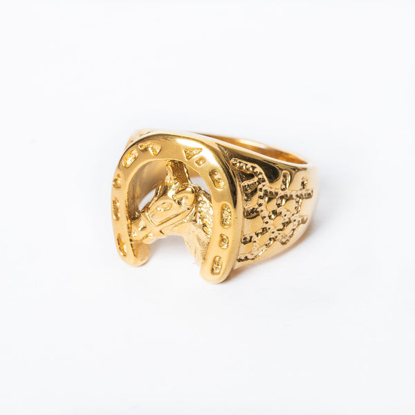 A gold-plated stainless steel Hunky Horse Ring with a horse motif design, displayed on a white background.