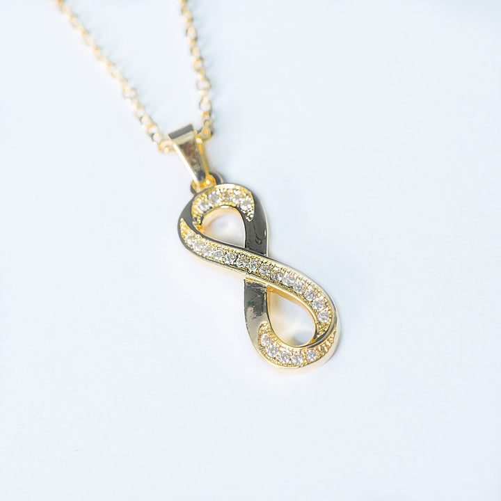 Ina gold necklace with crystal infinity pendant
