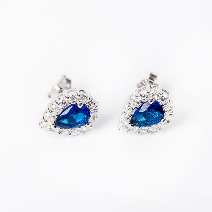 And irene earrings close up view standing against a white background. 