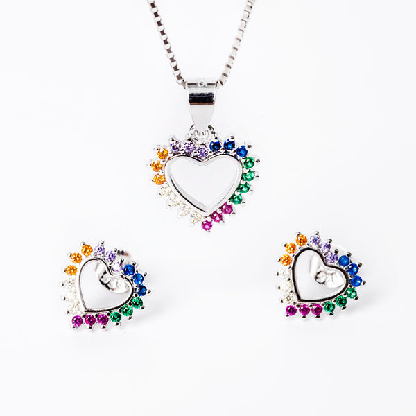 A set of sterling silver jewelry including a pendant, chain, and earrings, adorned with colorful cubic zirconia in a heart shape design.