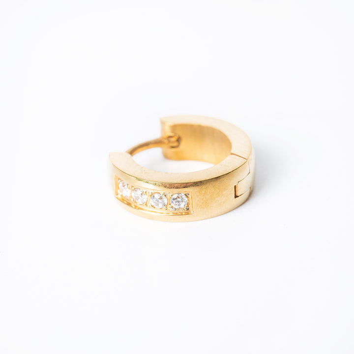 Jacob gold earrings standing in the center of the image against a white background. 