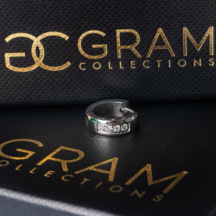 Jacob Silver Earrings placed on its originally designed Gram's black box. 