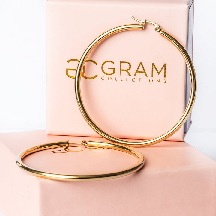 AS Joan Earrings standing in the center of the image against a white background. 
