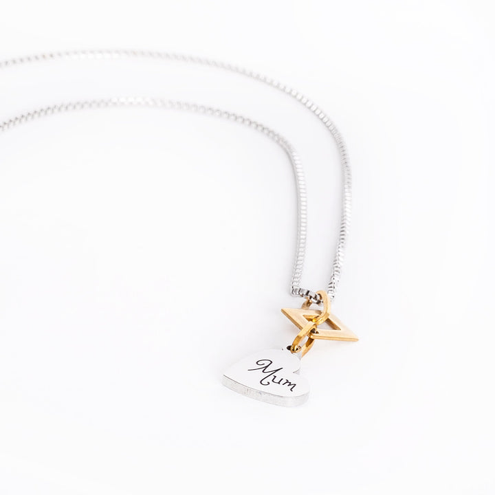 A side view of Judith necklace surrounded by a white background. 
