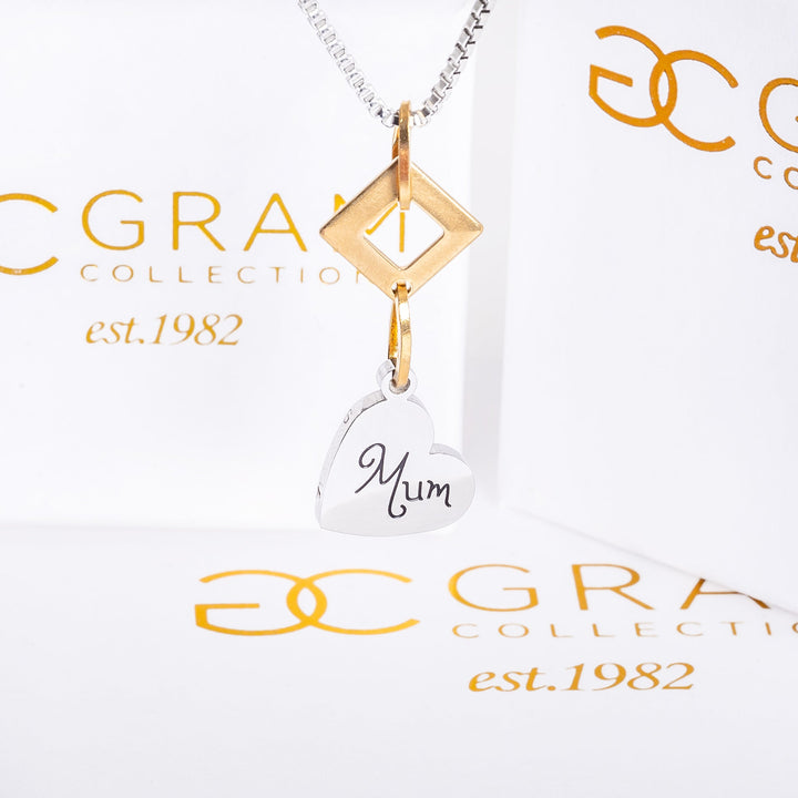 Judit necklace hanging from the top surrounded by its uniquely designed Gram collection box. 