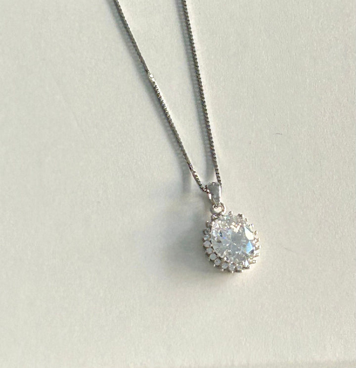 A close up view of whote stone Kate Necklace standing in the center of the image against a white background.