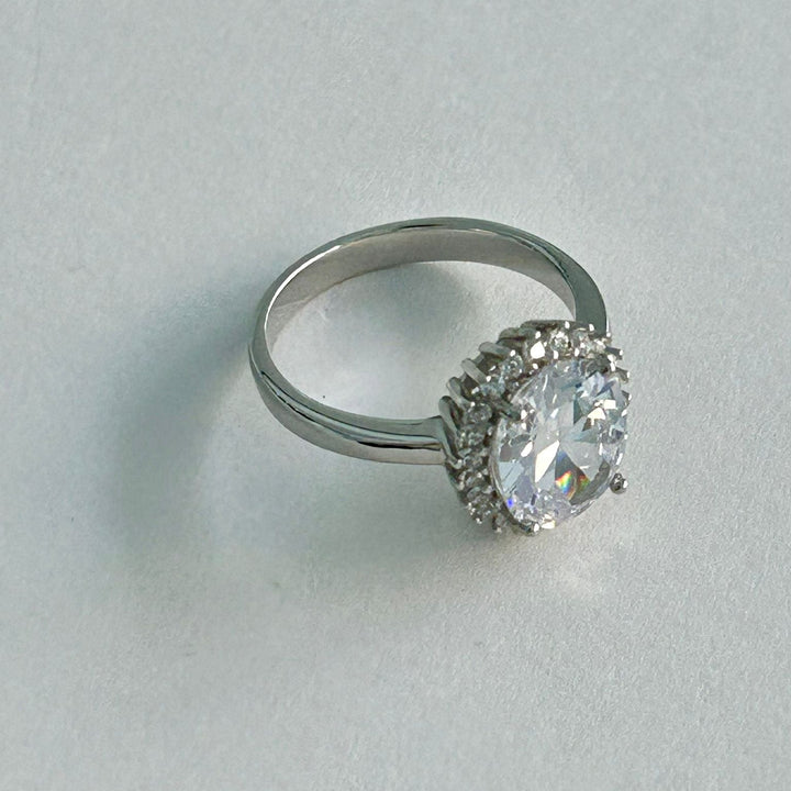 Wallapper of Kate Ring standing in the center of the image. 
