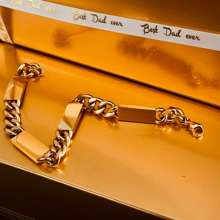 large bar bracelet stretched over orange surface. 