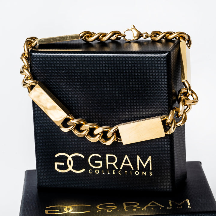 a close up view of Large Bar  Bracelet (Maltese Style) standing in the center of the image placed on its box. 