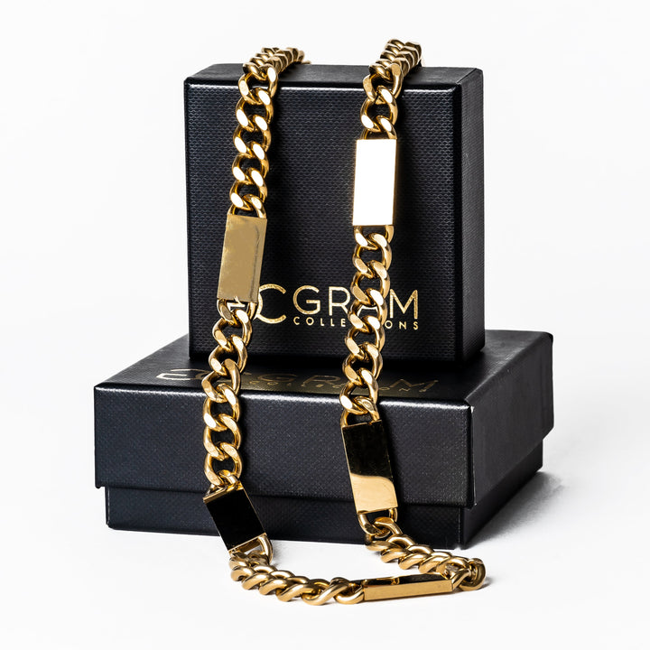 A close up view of Large Bar Necklace (Maltese Style) placed on its box, standing in the center of the image against a white background. 