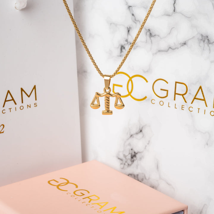a layer necklace of gram collections, standing in the center of the image. 