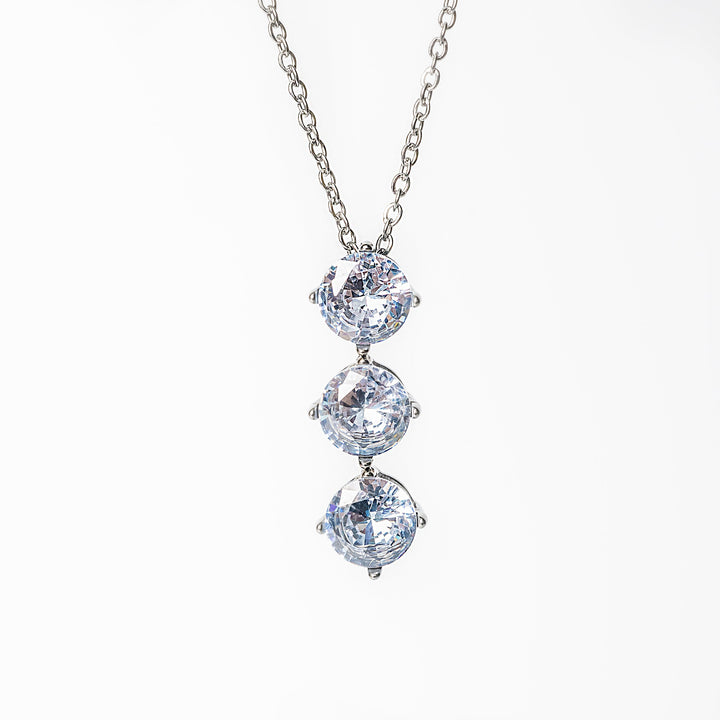 Silver Leia necklace featuring three vertically aligned clear gemstones.
