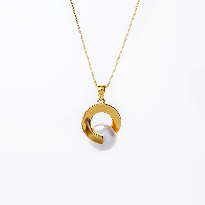 A sterling silver Lexy necklace with a gold chain and a gold-colored pendant featuring a cultured pearl or cubic zirconia gemstone.