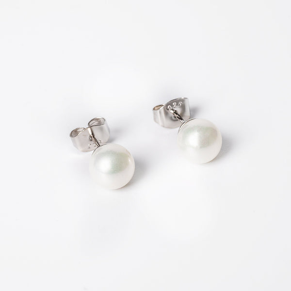 A liliana earrings close up view while standing against a white background. 
