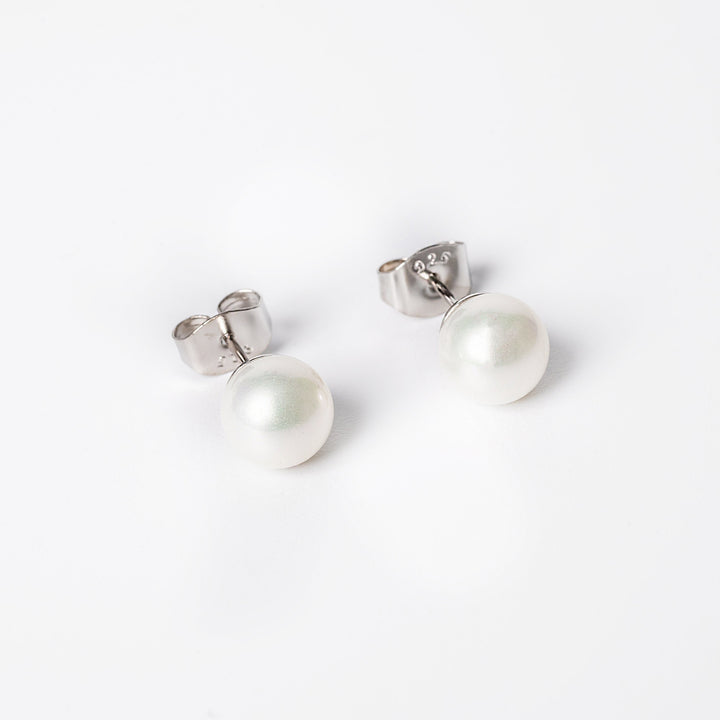 A liliana earrings close up view while standing against a white background. 