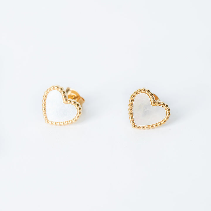 Lisa gold stud earrings with open heart design and textured edges